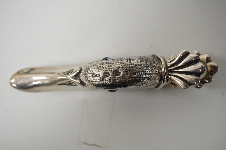 A modern novelty ebony handled silver back scratcher, 	Francis Howard Ltd, London, 2008, 38.6cm, a modern silver novelty duck’s head combination paperclip/match strike, London, 1905 and a silver shoe-horn. Condition - fa